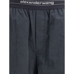 Trousers with elastic waistband and contrasting jacquard logo